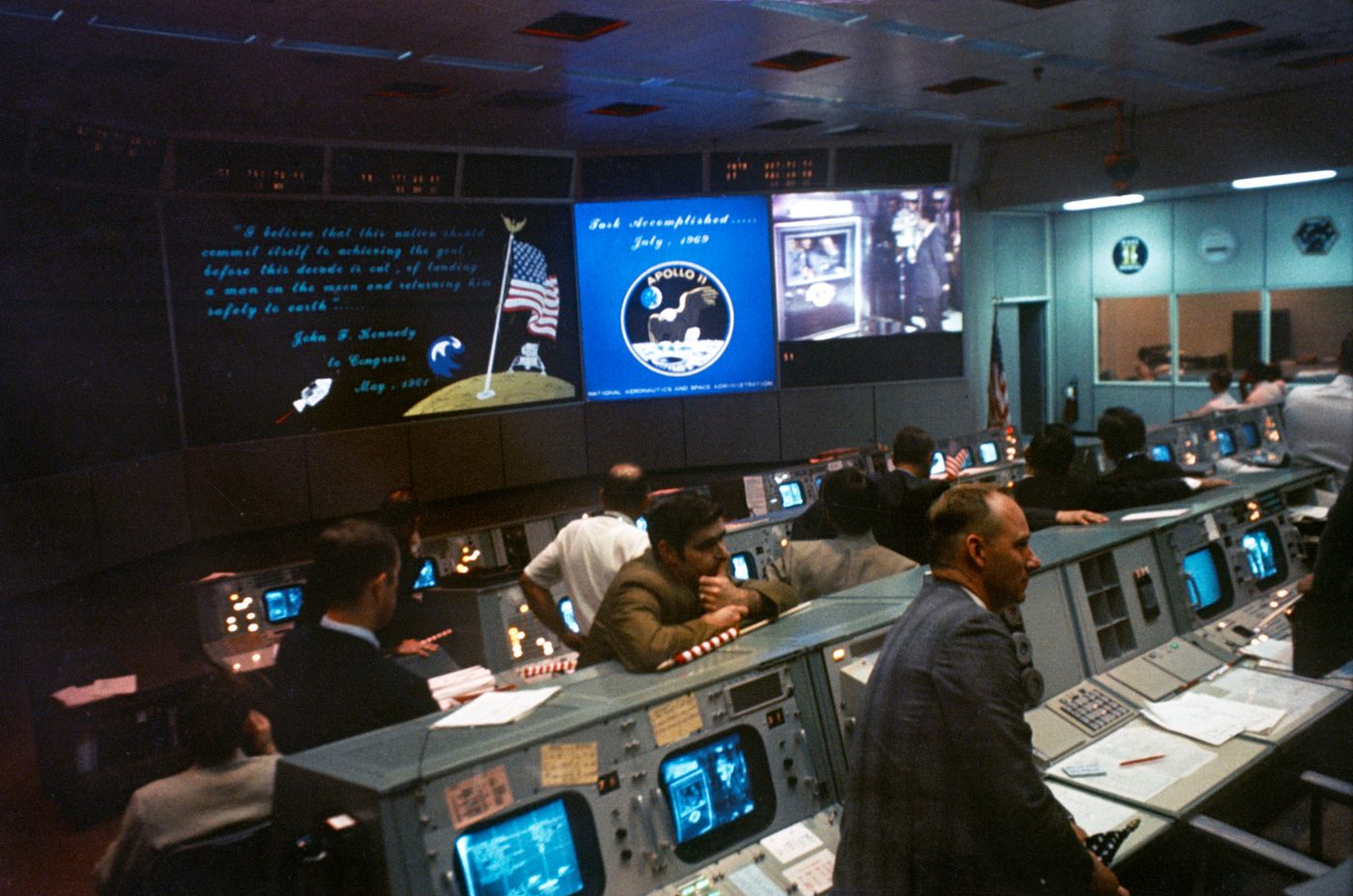 Figure 4 — The Mission Operations Control Room in Houston during Apollo 11. The guidance officer's console — where Steve Bales made the call — sat in the "Trench," the front row of consoles. Photo:…
