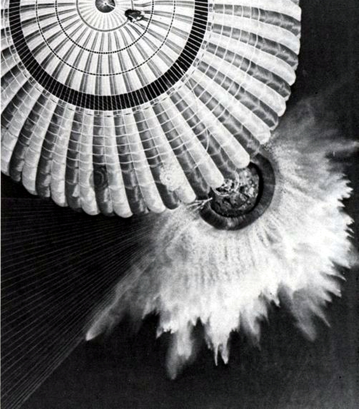 Figure 3 — The Apollo 17 Command Module descends under its three main parachutes to splashdown in the Pacific, 19 December 1972, at the end of a computer-guided lifting reentry. File:Splashdown of …