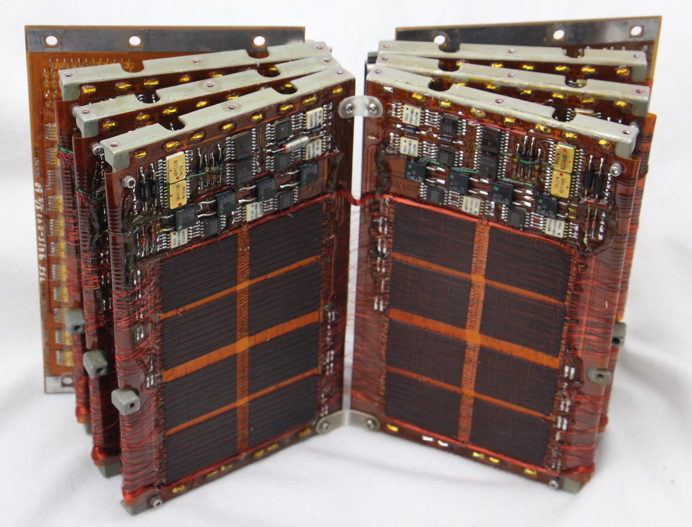 Figure 4 — A coincident-current magnetic-core memory board of the Apollo era; erasable RAM like this gave the AGC its read/write scratchpad. Photo: File:Titan Missile Core Memory Board (49570705568…