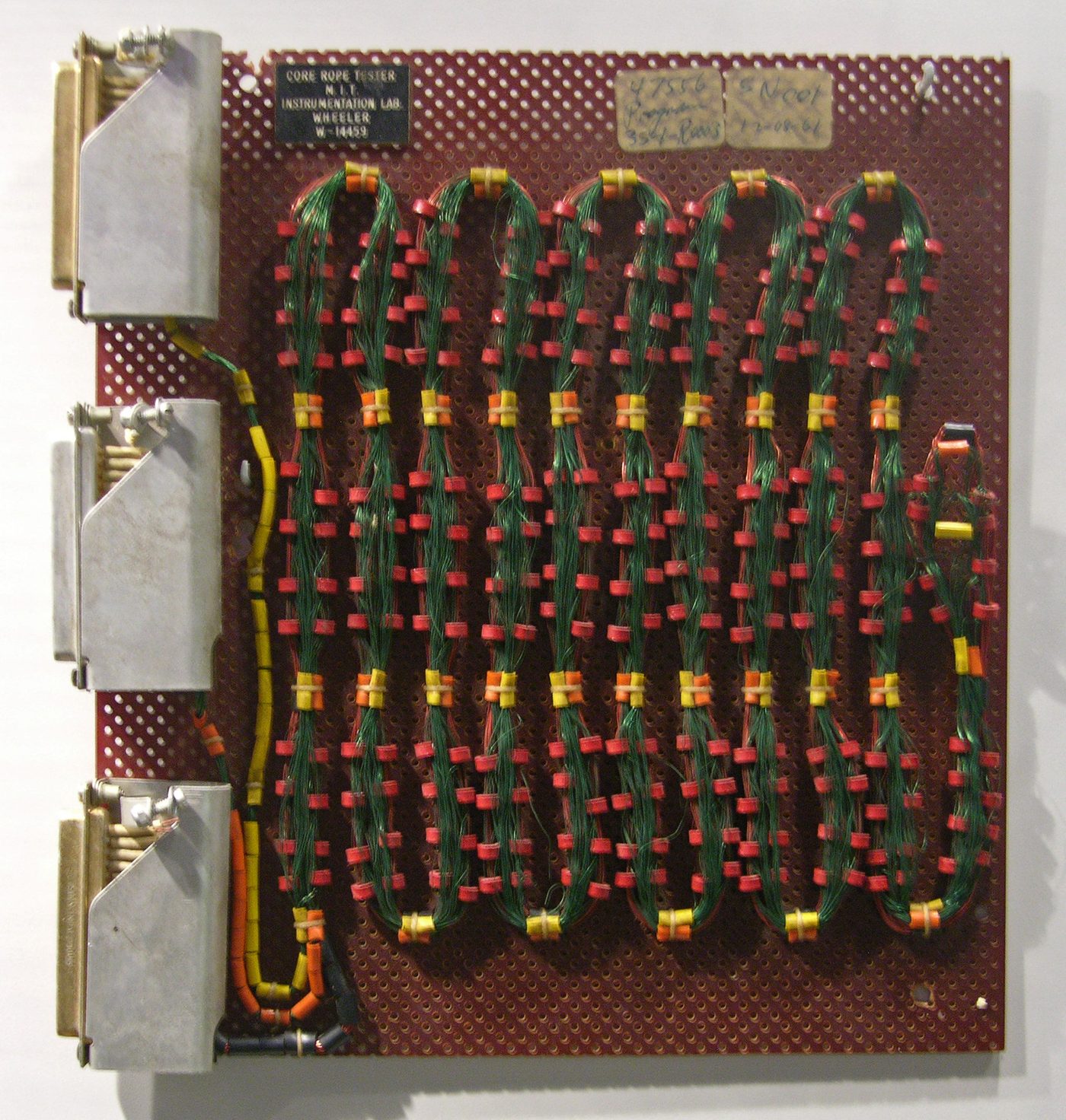 Figure 3 — Woven ferrite-core memory of the kind used in the AGC. Erasable memory used coincident-current cores; the program lived in read-only core rope, where a wire threaded through a core meant…