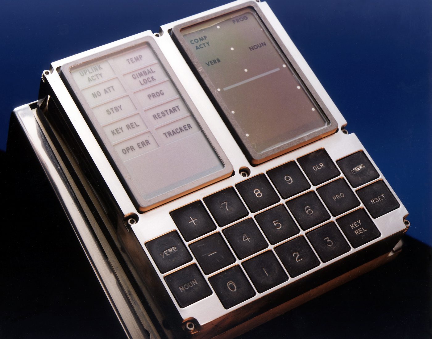 Figure 5 — The AGC's exterior partner, the Display and Keyboard unit (DSKY). The computer itself was mounted out of sight; the crew met it only through this panel of verbs, nouns, and warning light…