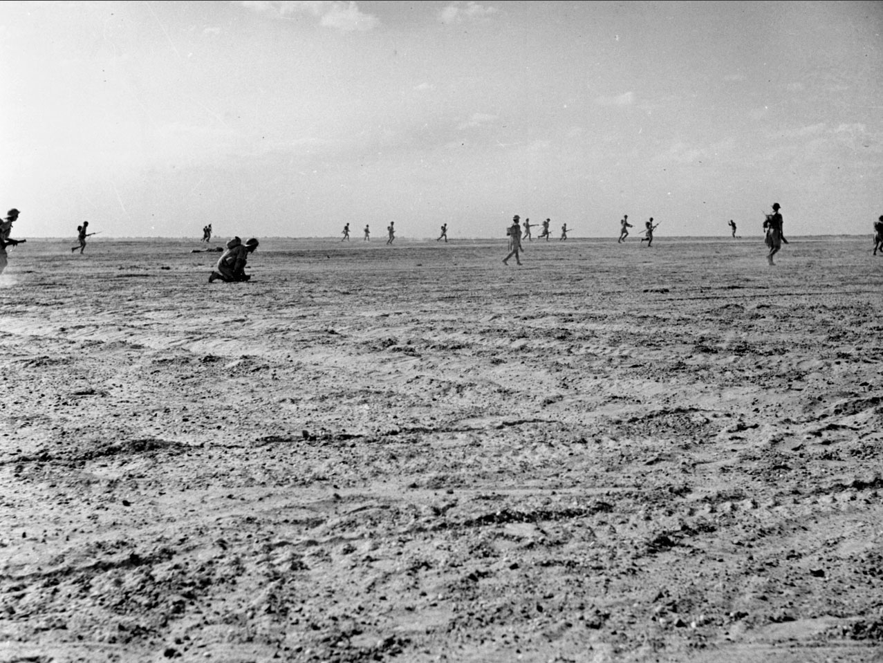 Figure 2 — British infantry advancing at El Alamein, 1942. Ultra gave Montgomery Rommel's order of battle before the fighting and Rommel's own situation reports during it. Photo: File:E-18511 el Al…
