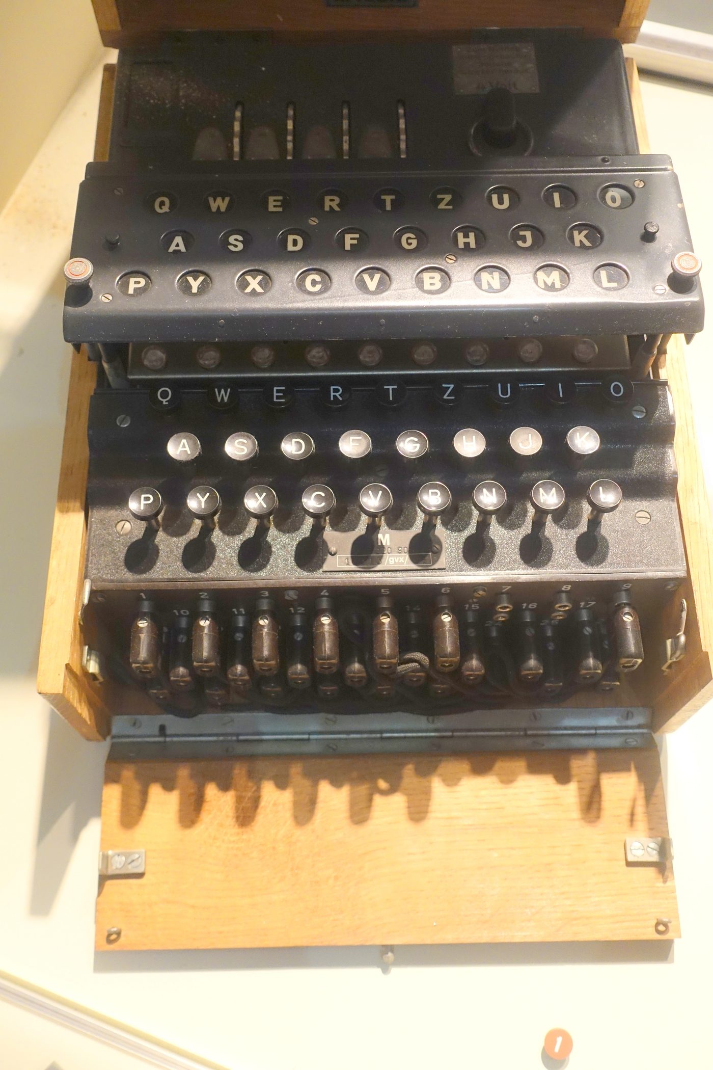 Figure 2 — A four-rotor Kriegsmarine M4, recovered from U-505 and displayed at the Museum of Science and Industry, Chicago. The fourth (thin) rotor sits at the left of the wheel window. Photo: File…